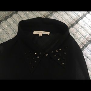 Spiked collar. Small black blouse. sleeveless